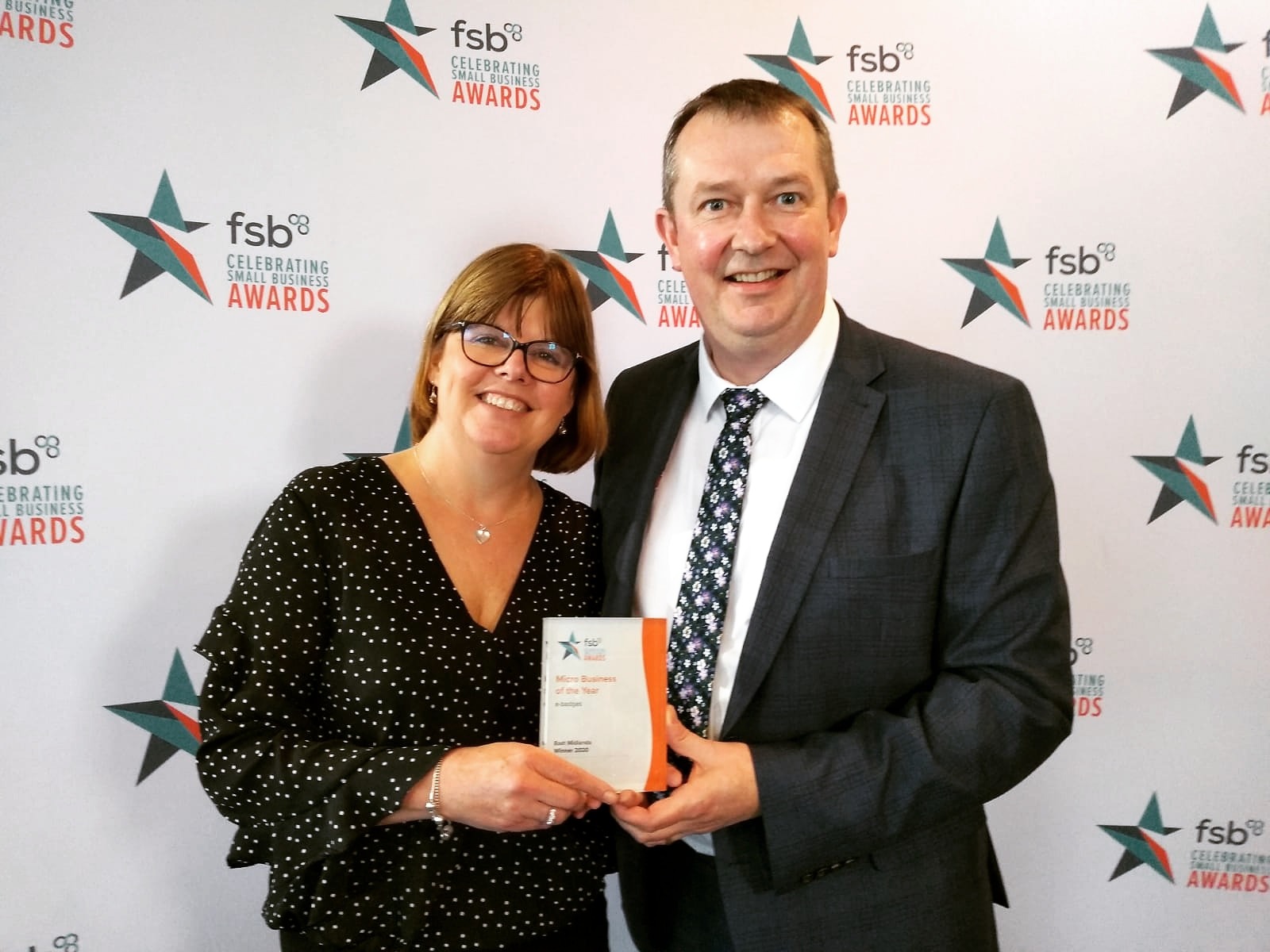 Andrew and Philippa Vear winning Micro Business of the Year regional award from Federation of Small Business FSB