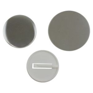 Components for a 58mm supersafe pinless badge to be made in a badge making machine comprising metal front, white plastic clip back and clear plastic film circle